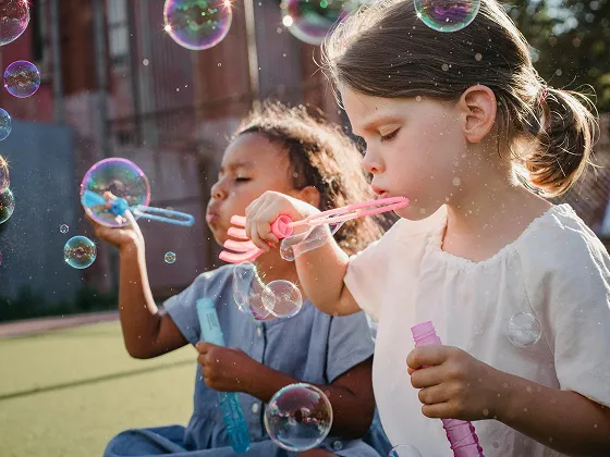 Children enjoying bubbles in the Kids Zone